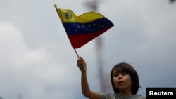 Joven manifestante en una protesta en contra del gobierno de Nicolás Maduro, en Caracas, el 28 de septiembre de 2024. (Reuters/Leonardo Fernández Viloria).